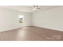 Inviting bedroom with natural light, neutral walls and flooring, creating a serene retreat at 3320 Burberry Dr, Gastonia, NC 28052