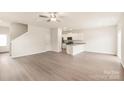 Spacious living area with luxury vinyl flooring, recessed lighting and an open-concept design at 3342 Strong Box Ln, Gastonia, NC 28052
