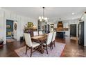 Elegant dining room with hardwood floors and a view of the kitchen at 355 Cal Kennedy Rd, Cleveland, NC 27013