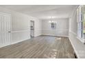 Bright, open living room featuring neutral paint and modern flooring at 3637 Glenville Rd, Charlotte, NC 28215