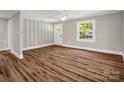 Spacious living room featuring new flooring, modern paint, and natural light at 411 W Sycamore St, Lincolnton, NC 28092