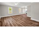 Living room features new flooring, neutral paint, and windows with outdoor views at 411 W Sycamore St, Lincolnton, NC 28092