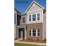 New townhome with brick and gray wood-look exterior and inviting front entrance at 483 Shasta St # 5202, Gastonia, NC 28052