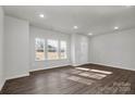 Bright, spacious living room with wood-look floors and multiple windows at 483 Shasta St # 5202, Gastonia, NC 28052