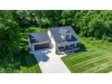 Aerial view showcases home with a spacious yard, front porch, and attached garage at 4941 Southview Dr, Hickory, NC 28602