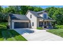 Attractive home showcasing a front-facing two-car garage and welcoming front porch with classic rocking chairs at 4941 Southview Dr, Hickory, NC 28602