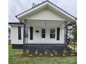Charming single-story home featuring black shutters and freshly mulched landscaping around the front foundation at 520 E Maple Ave, Gastonia, NC 28054