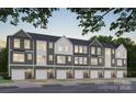 New townhome featuring a gray exterior, front doors, and one car garages in a well-manicured community at 534 Beatties Ford Rd, Charlotte, NC 28216