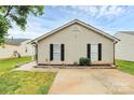 Well-maintained home with neat landscaping and a concrete driveway at 5804 Fairchase Ave, Charlotte, NC 28269