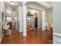 Open living space with hardwood floors, columns, and neutral paint at 5849 Mcclintock Dr # 117, Denver, NC 28037