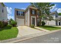 Well-maintained two-story home with an attached garage and traditional curb appeal at 7711 Brisbane Ct, Charlotte, NC 28215