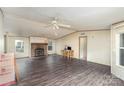Spacious living room features a stone fireplace and wood flooring, offering a cozy and inviting atmosphere at 811 Acclaim Dr, York, SC 29745