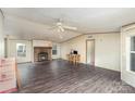 Spacious living room features a stone fireplace and wood flooring, offering a cozy and inviting atmosphere at 811 Acclaim Dr, York, SC 29745
