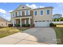 Charming two-story home with a well-manicured lawn and attached two-car garage at 9533 Silverdale Ln, Charlotte, NC 28269