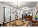 Cozy living area with hardwood floors, an area rug, large windows, and ample natural light at 9533 Silverdale Ln, Charlotte, NC 28269