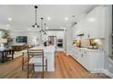 Open concept kitchen with an expansive island, modern stainless steel appliances, and plenty of countertop space at 12047 Lavinia Ln, Charlotte, NC 28277