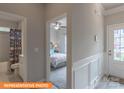 Inviting bedroom with a ceiling fan, neutral paint, and an adjacent bathroom with tub at 1260 Langston Ln, Salisbury, NC 28144