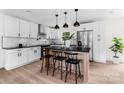 Modern kitchen with stainless steel appliances, a center island with seating, and white cabinetry at 1537 Spangler Dr, Shelby, NC 28150