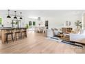 Open-concept living space features a modern kitchen, dining area, and inviting living room at 1537 Spangler Dr, Shelby, NC 28150