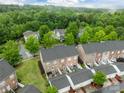An aerial view shows the neighborhood's lush landscaping and well-maintained exteriors at 16930 Summers Walk Blvd, Davidson, NC 28036