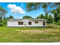Well-maintained single story home with white exterior, red shutters, and easy ramp access at 2002 Kingston Rd, Kingstown, NC 28150