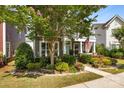 Charming two-story home featuring a balcony, well-kept garden, and an inviting facade at 2007 Bishops Ct, Cornelius, NC 28031