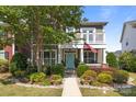 Charming two-story home featuring a balcony, well-kept garden, and an inviting facade at 2007 Bishops Ct, Cornelius, NC 28031