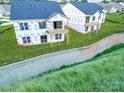 Exterior view of new construction homes with rear decks and partially fenced yards at 2085 Bonds Ln # 26, Fort Mill, SC 29715