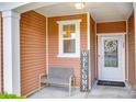Inviting front porch with a cozy bench and a welcoming atmosphere for relaxing at 244 River Clay Rd, Fort Mill, SC 29708