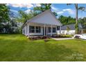 Beautiful, well-maintained home with a lush green lawn and an inviting covered porch at 321 Whitner St, Rock Hill, SC 29732