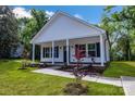 A cozy home featuring a welcoming front porch and recently planted landscaping at 321 Whitner St, Rock Hill, SC 29732