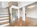 Stunning entryway with hardwood floors, staircase and large windows providing ample natural light at 5183 Mill Race Ln, Lancaster, SC 29720