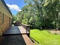 Wooden deck overlooking a lush, green backyard providing a serene outdoor space at 5495 Valley Run St, Hickory, NC 28601