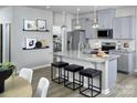 Open concept kitchen featuring granite countertops, stainless steel appliances, and a spacious island at 7108 Hodges Meadow Ln, Charlotte, NC 28213