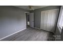 The bedroom features modern gray flooring and an adjacent closet at 824 S Laurel St, Lincolnton, NC 28092