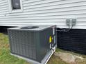 Close up of the air conditioning unit in the lawn at 103 Meadow Ne Ave # 6, Concord, NC 28025