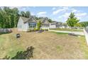 View of well-kept homes, manicured lawns, landscaping and beautiful curb appeal in a quiet neighborhood setting at 160 Tanner Loop, Troutman, NC 28166
