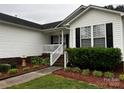Charming home featuring a covered front porch and landscaped yard at 165 Kimball Rd, China Grove, NC 28023