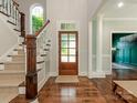 Bright foyer with hardwood floors, staircase, and a view into other rooms at 1814 Therrell Farms Rd, Waxhaw, NC 28173