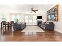 Bright and airy living room featuring hardwood floors, a fireplace, and ample natural light at 214 Blossom Ridge Dr, Mooresville, NC 28117