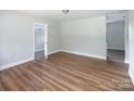 Bright living room featuring wood floors and neutral paint colors at 2409 Thornton Rd, Charlotte, NC 28208