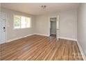Inviting living room with wood floors and plenty of natural light at 2409 Thornton Rd, Charlotte, NC 28208