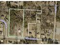 Aerial view of property, showing lot boundaries, surrounding wooded area, and nearby roads at 2645 Kool Park Ne Rd, Hickory, NC 28601