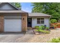 Attractive single-story home with a brick facade, attached garage, and a neatly landscaped front yard at 2750 Victory Ct, Fort Mill, SC 29715