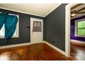 This cozy living room features hardwood floors, dark walls, and trim at 2905 Grimes St, Charlotte, NC 28206
