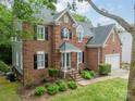 Beautiful brick home with manicured landscaping and an attached two-car garage at 2907 Notchview Ct, Charlotte, NC 28210