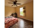 Cozy bedroom with natural light and comfortable furnishings; a peaceful retreat at 3012 Longspur Dr, Matthews, NC 28105