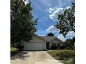 Charming one-story home featuring an attached garage and well-maintained front yard at 3012 Longspur Dr, Matthews, NC 28105