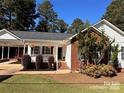 Traditional-style home with a brick and siding exterior, complemented by a cozy front porch at 625 Wildwood Dr, Rock Hill, SC 29730