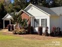 Well-maintained home featuring brick and vinyl siding with lush landscaping at 625 Wildwood Dr, Rock Hill, SC 29730
